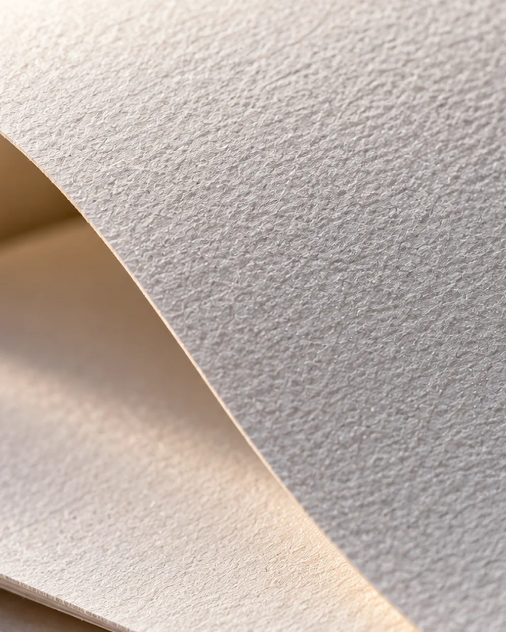 Premium ivory letterhead sheet with a soft paper curl